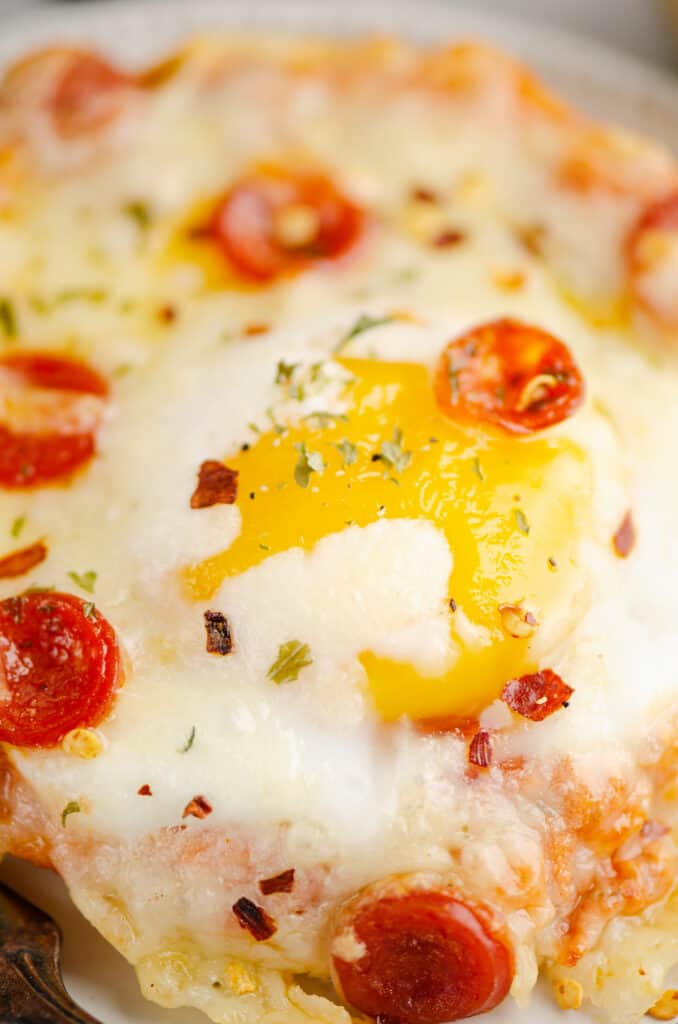 soft egg yolk in the middle of english muffin breakfast pizza