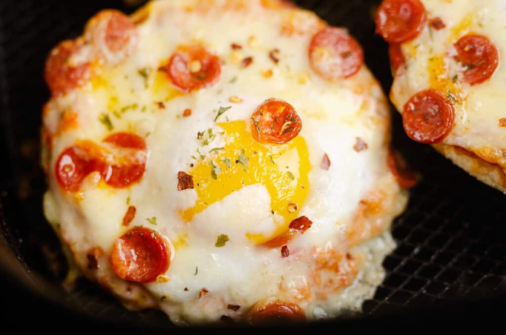 cheesy pepperoni egg pizzas in Air Fryer basket