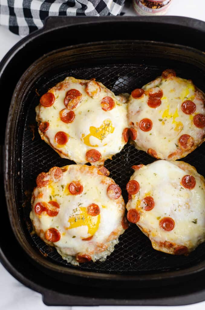 english muffin breakfast pepperoni pizzas in Air Fryer basket