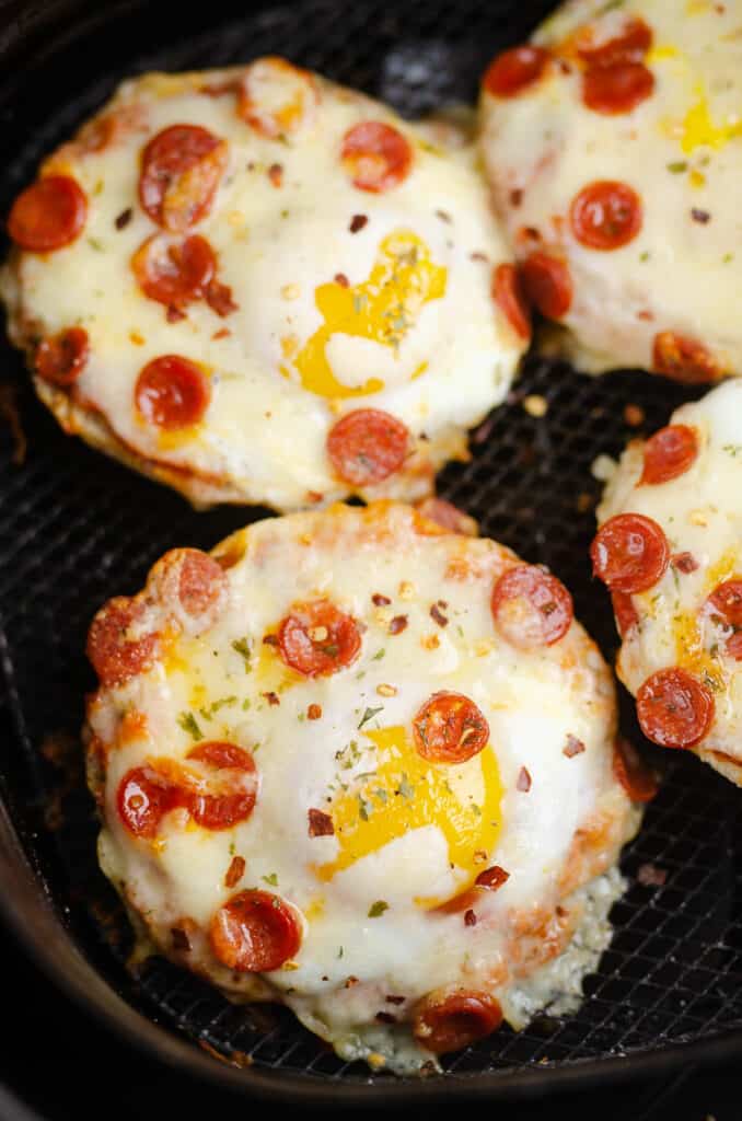 english muffin cheesy breakfast pizzas in Air Fryer basket