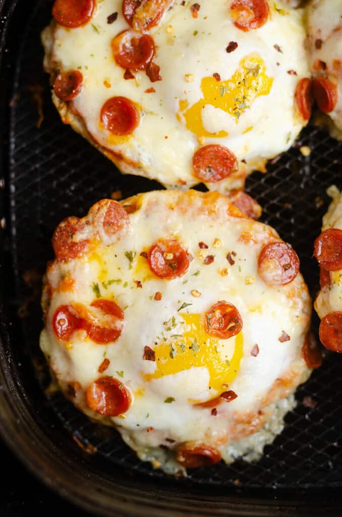 english muffin cheesy pepperoni egg pizzas in Air Fryer basket