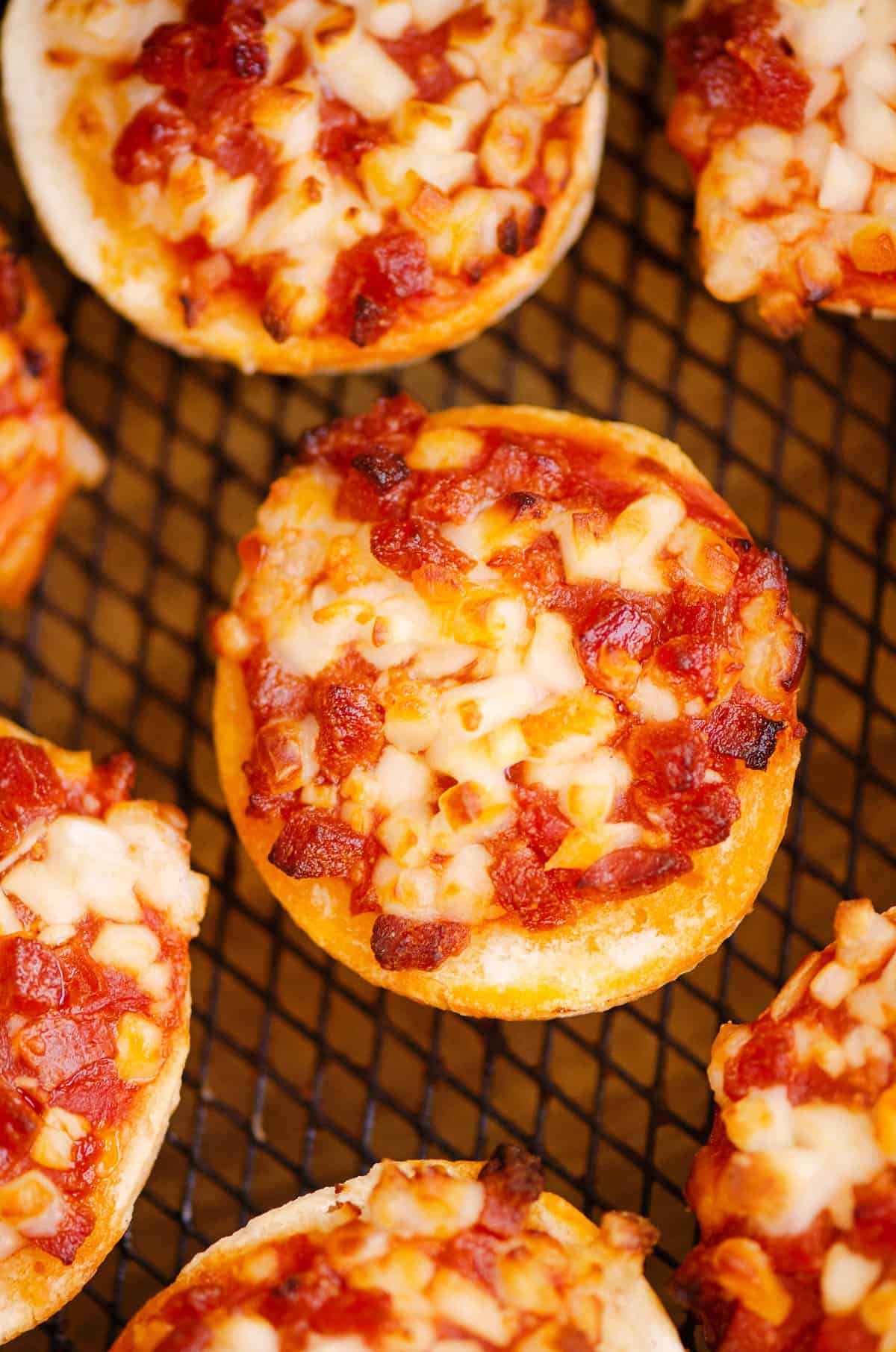 cooked bagel bites in Air Fryer basket