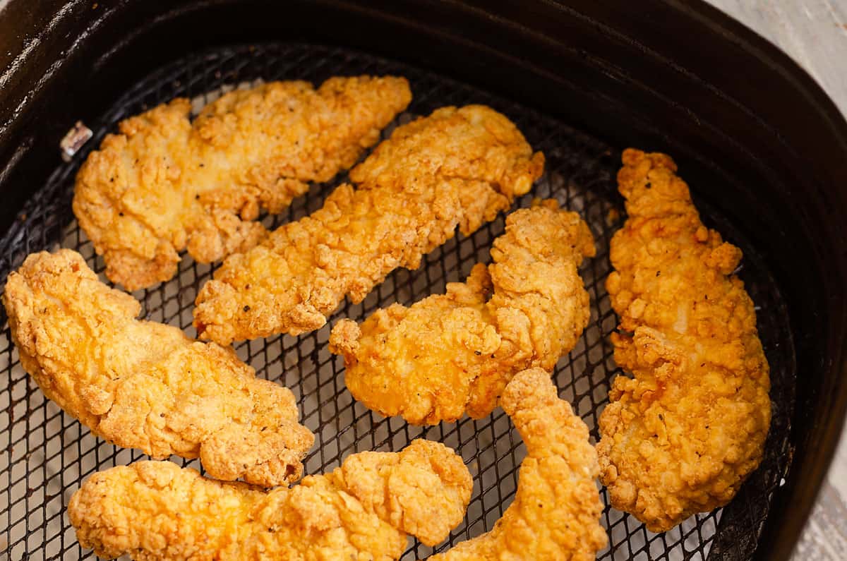 cooked chicken strips in Air Fryer Basket