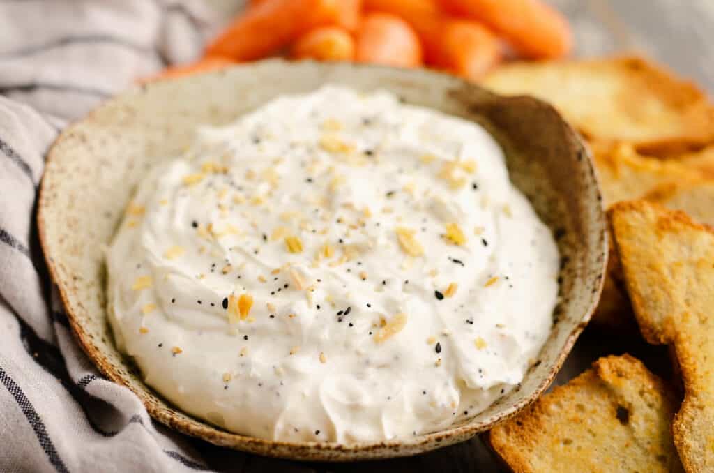 handmade bowl with everything bagel dip served with carrots and bagel chips