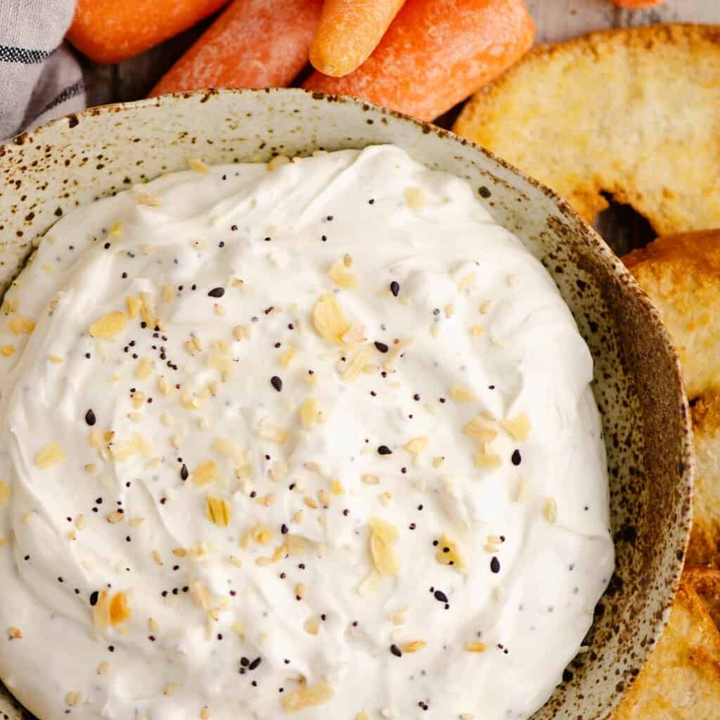 handmade bowl with everything bagel dip, carrots and bagel chips