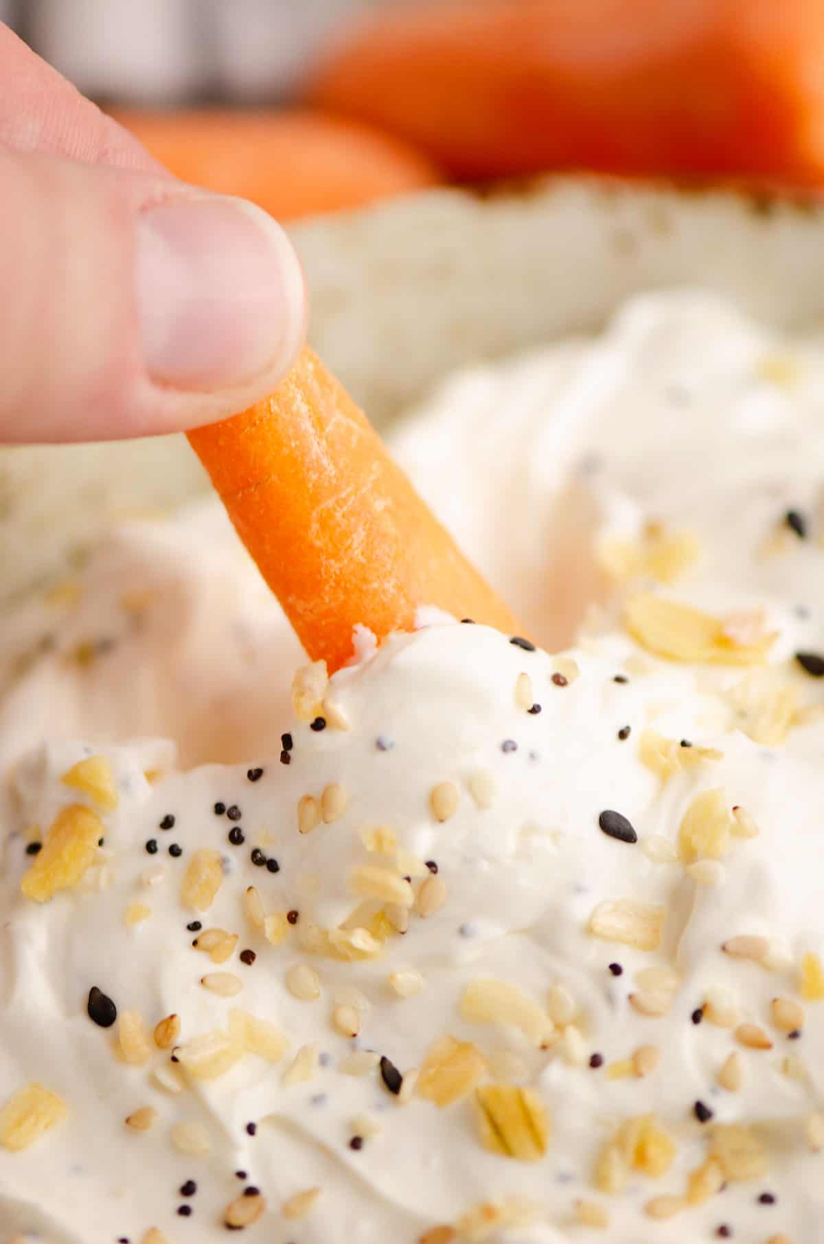 carrot dipped in everything bagel dip