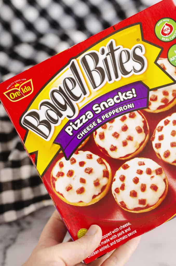 Pepperoni Bagel Bites pizza snacks box in hand