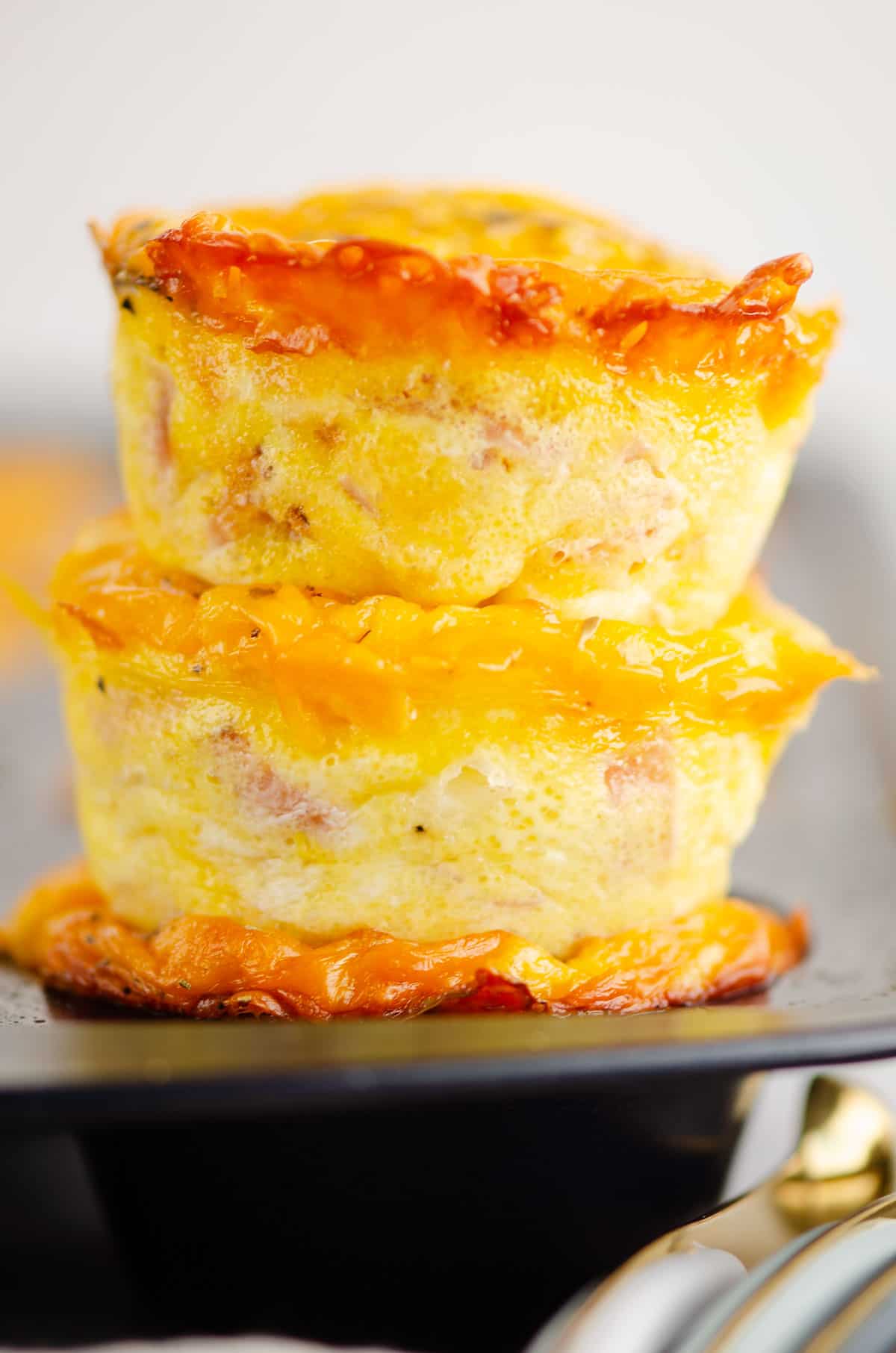 ham and egg cups stacked in pan