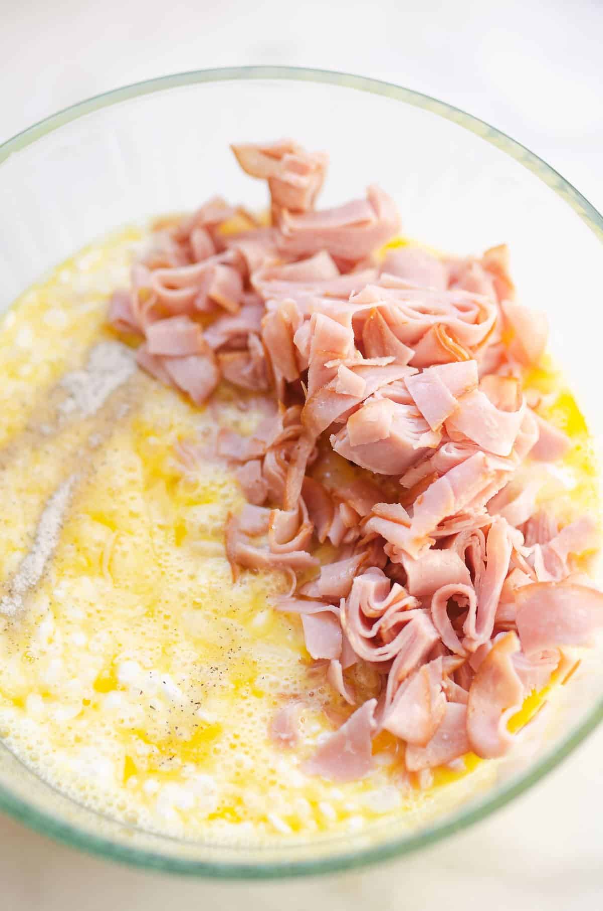 cottage cheese, egg and deli ham in glass bowl