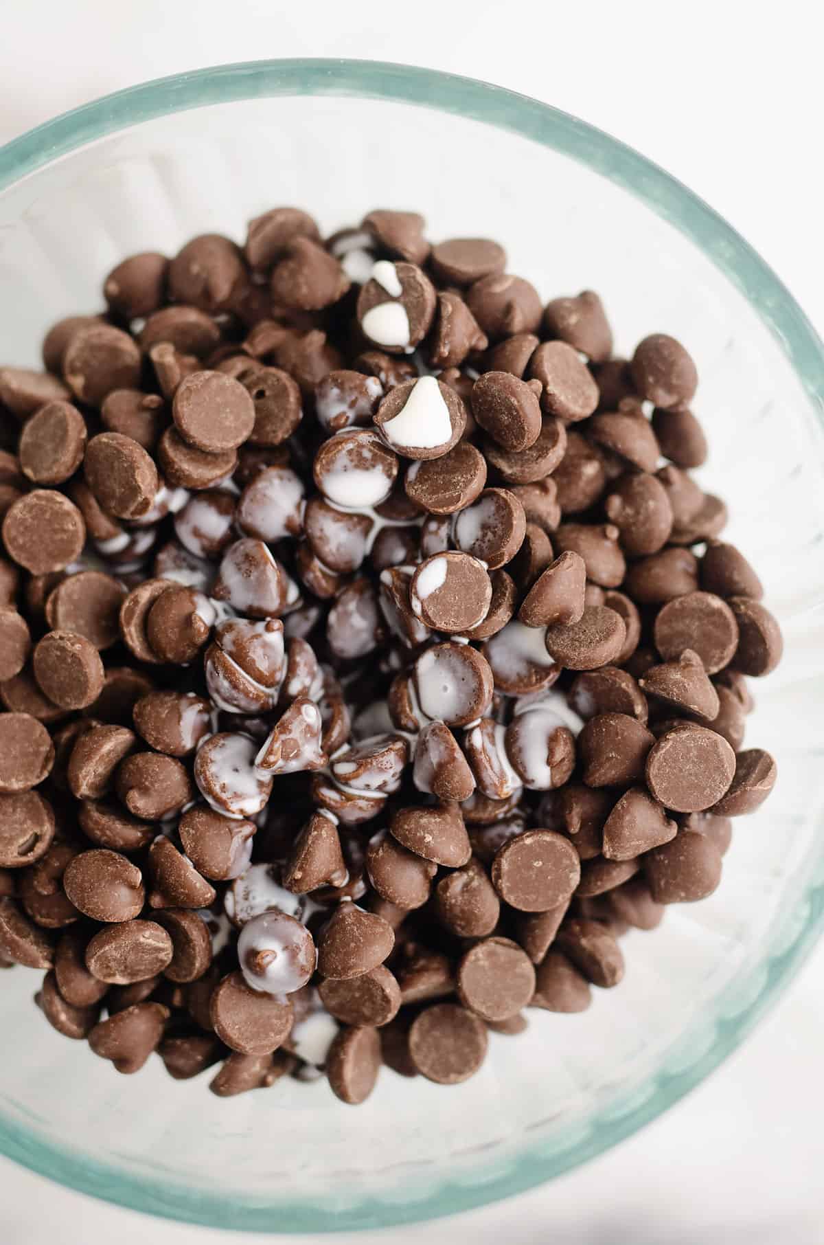 chocolate chips and cream in bowl