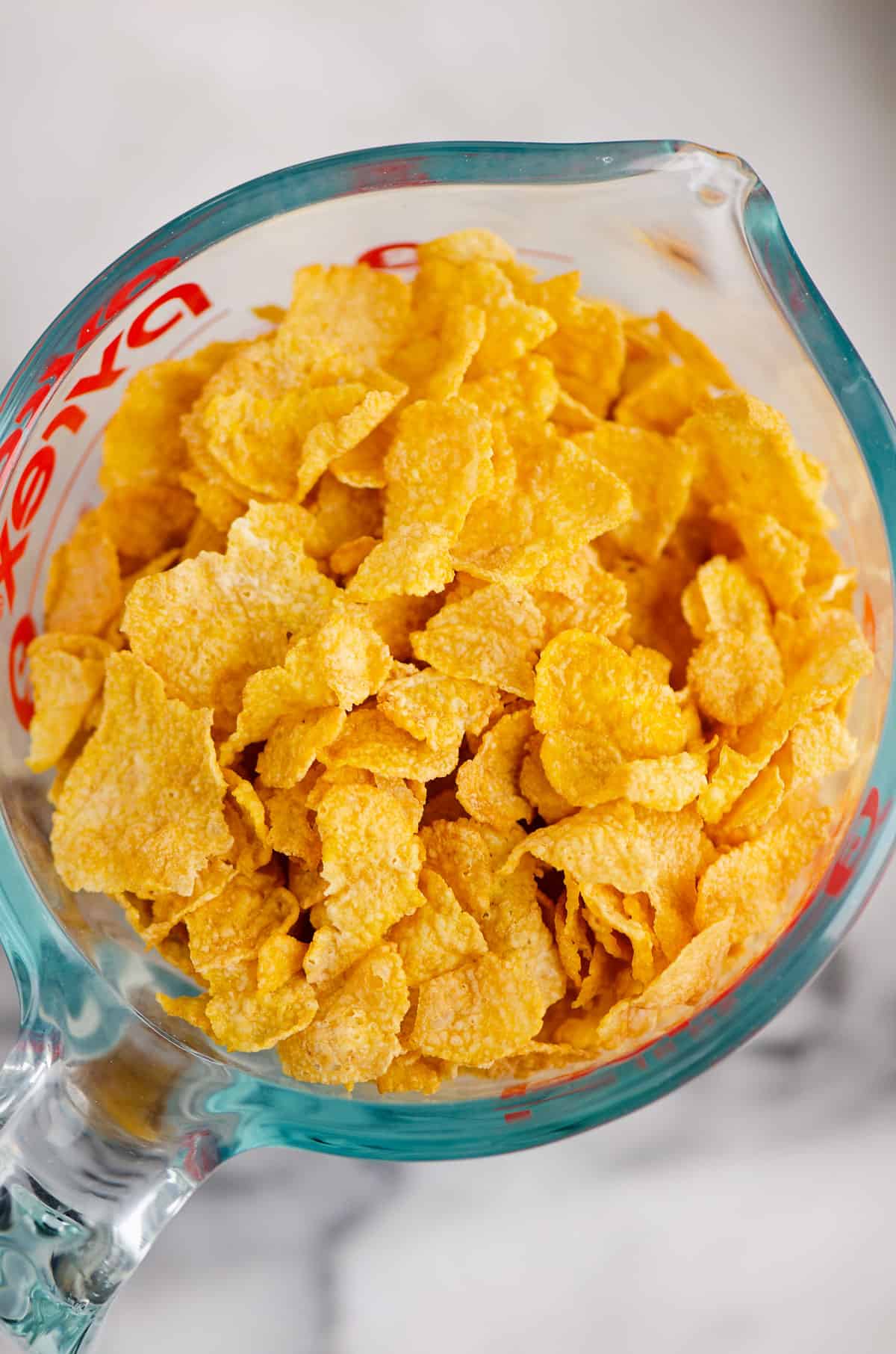 cornflakes in glass measuring cup