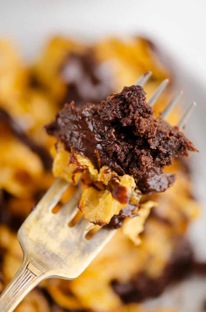 bite of chocolate ganache layered brownies on fork