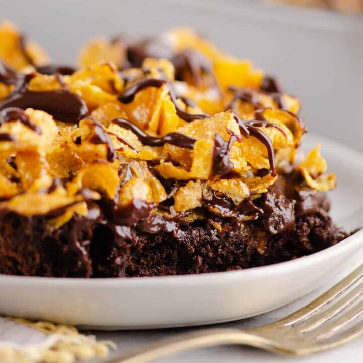 triple layered brownies with cornflakes on plate with napkin