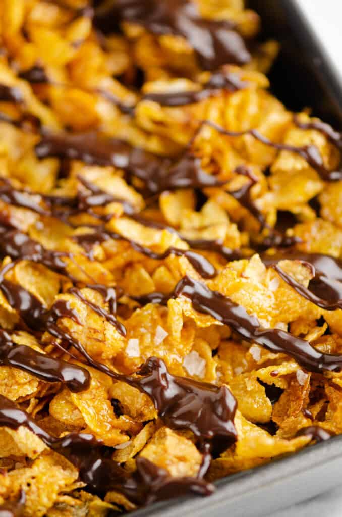chocolate ganache drizzled over cornflake brownies