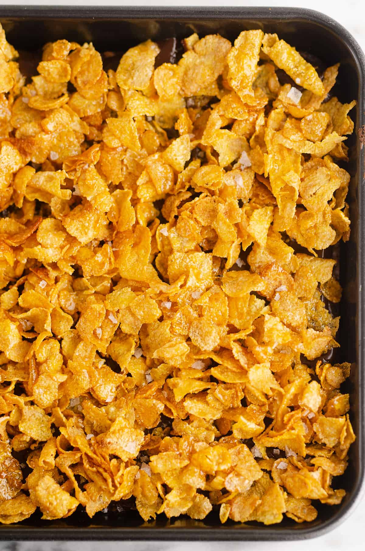 crunchy honey roasted cornflakes on baking pan