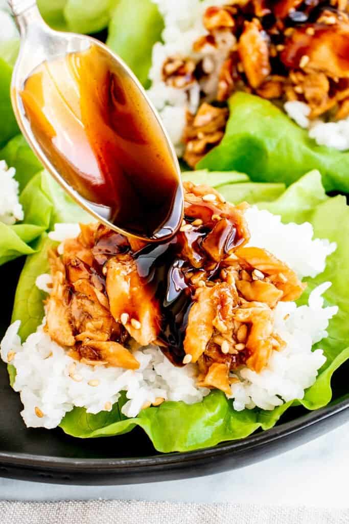 leftover salmon and rice lettuce cup with teriyaki sauce spooned over it