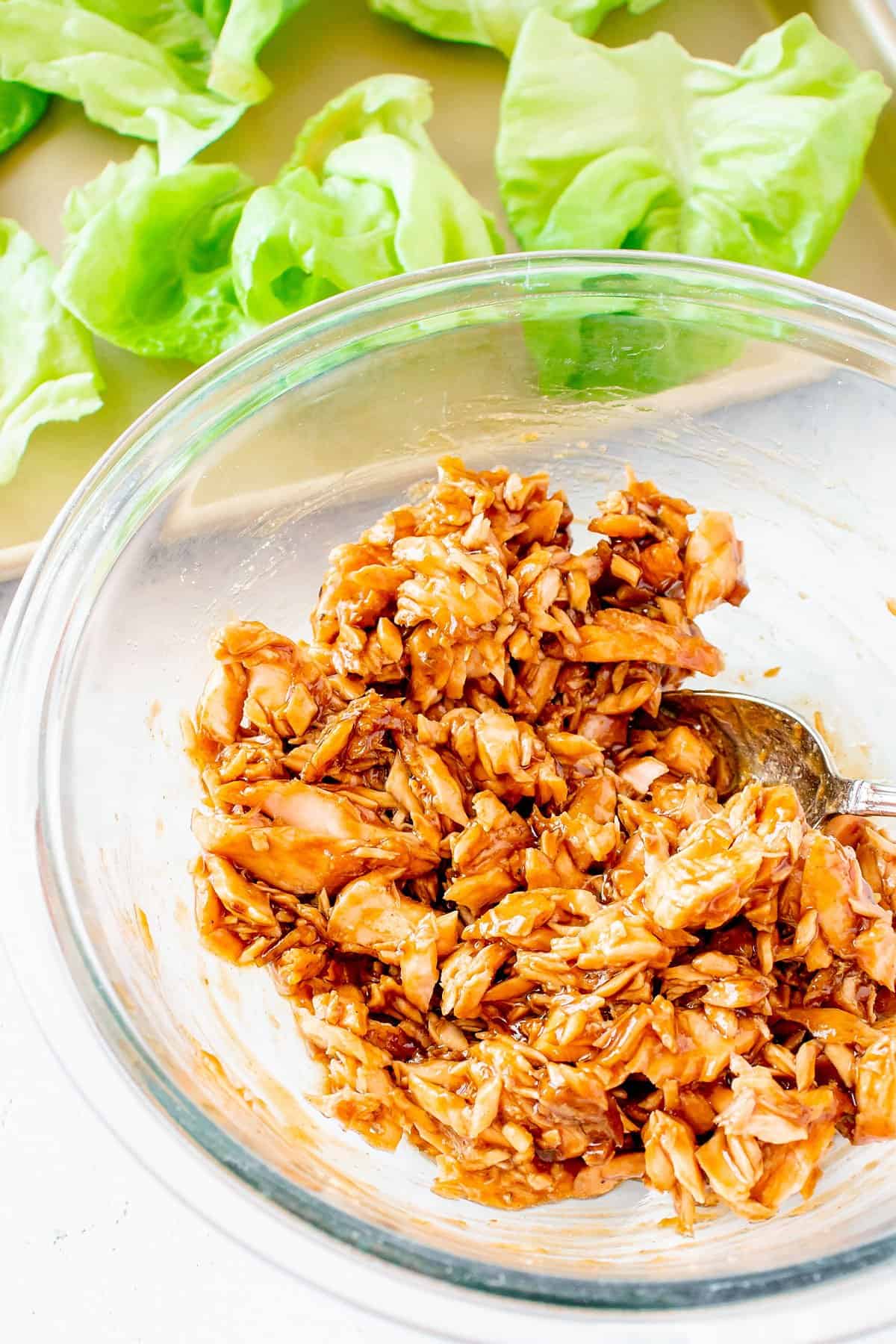 leftover cooked salmon tossed with teriyaki in glass bowl