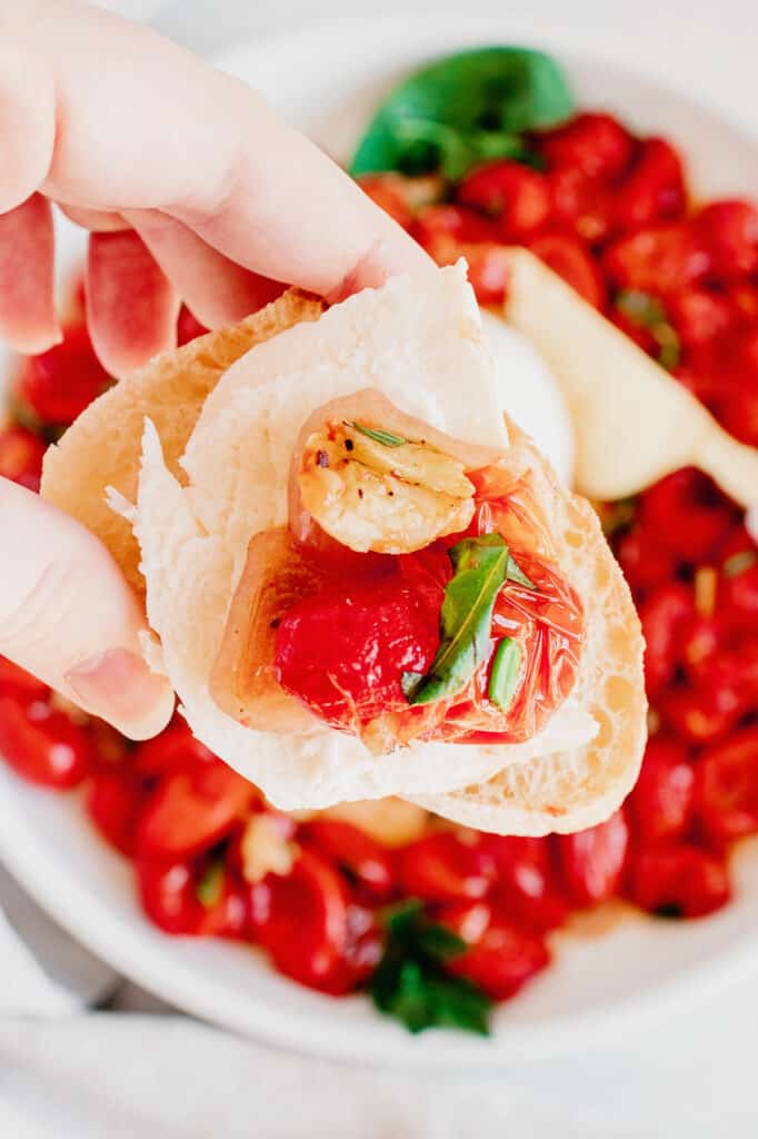 roasted tomatoes, garlic and mozzarella on crostini