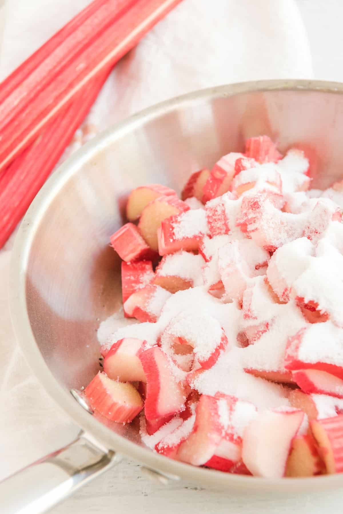 rhubarb in saucepan with sugar