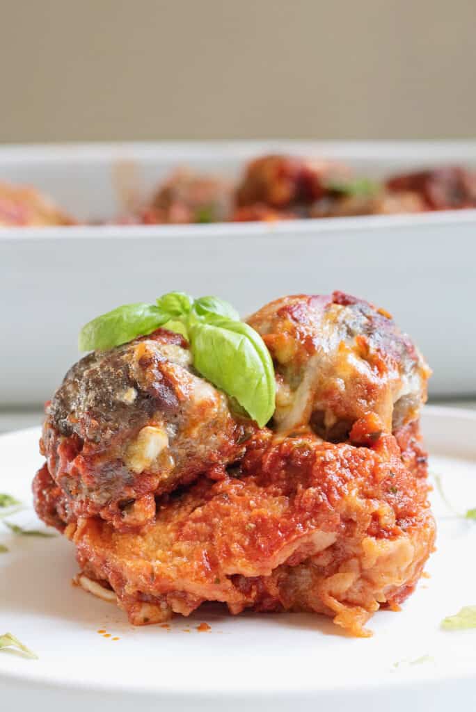 meatball sub casserole served on plate with basil