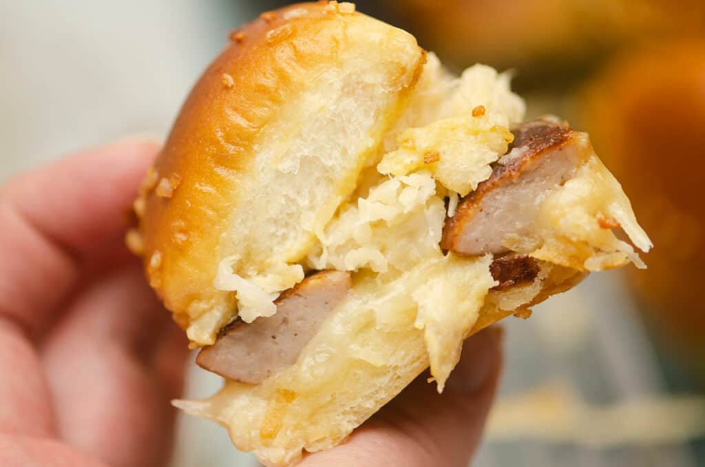 sauerkraut brat slider in hand