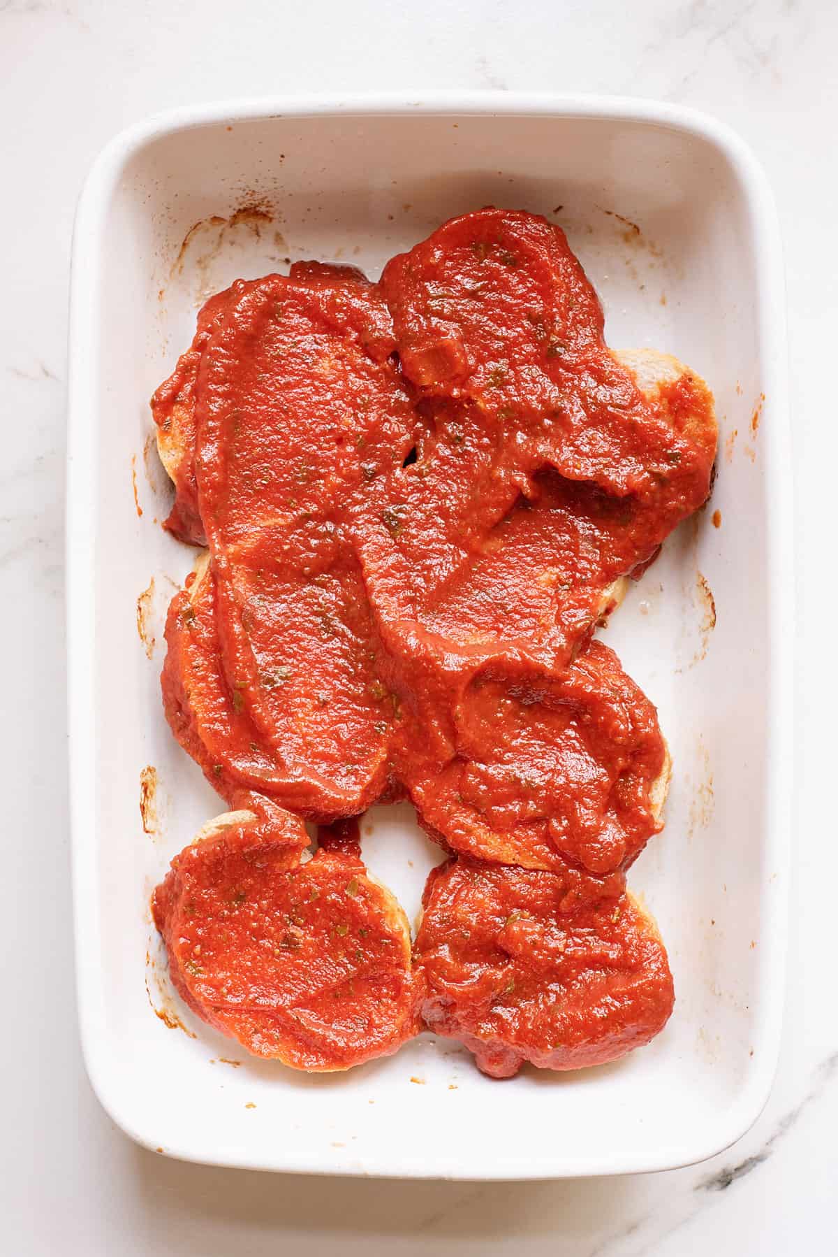 marinara covered bread in pan