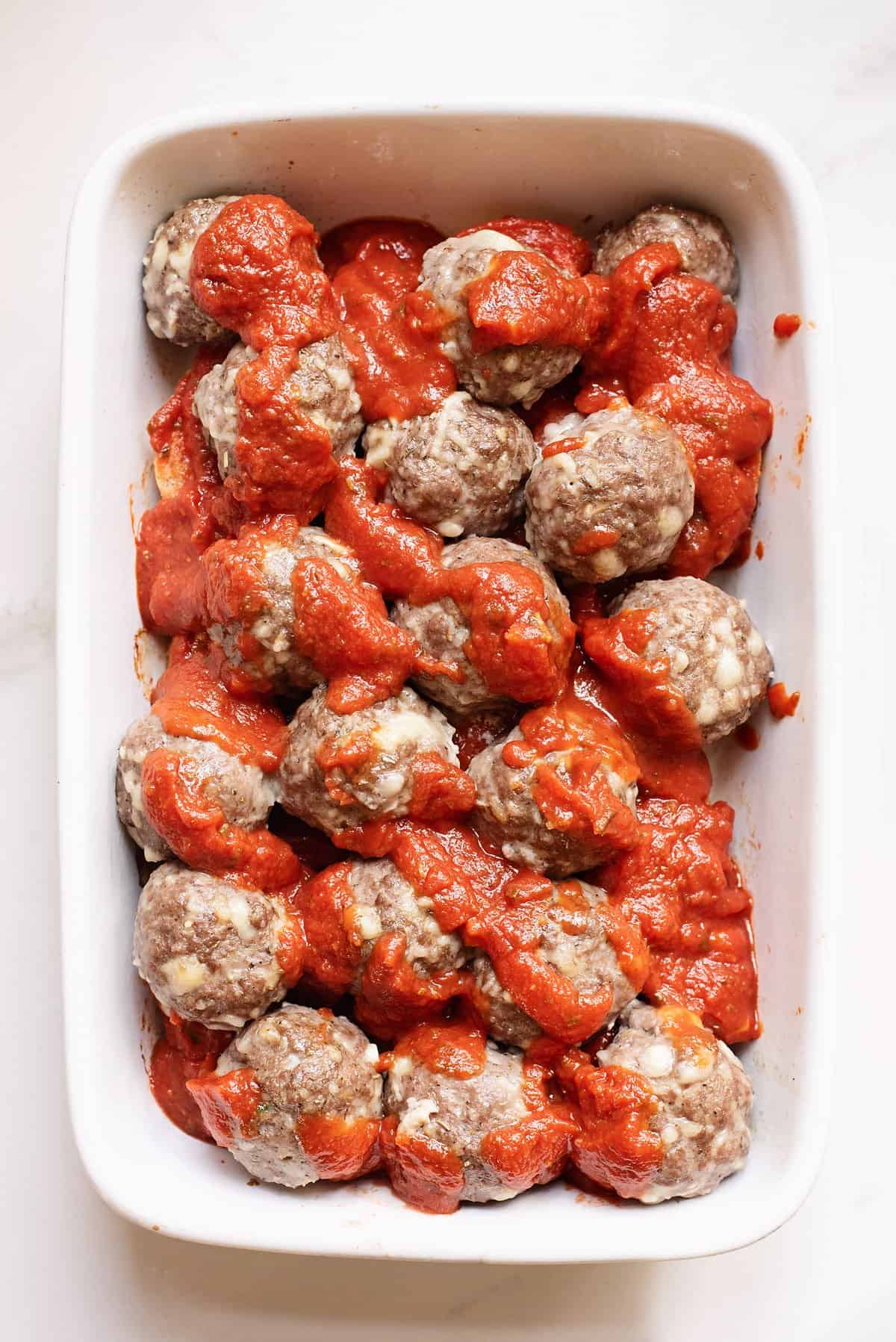 meatballs and marinara in baking dish