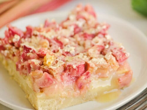 rhubarb dream bar on white plate with fork