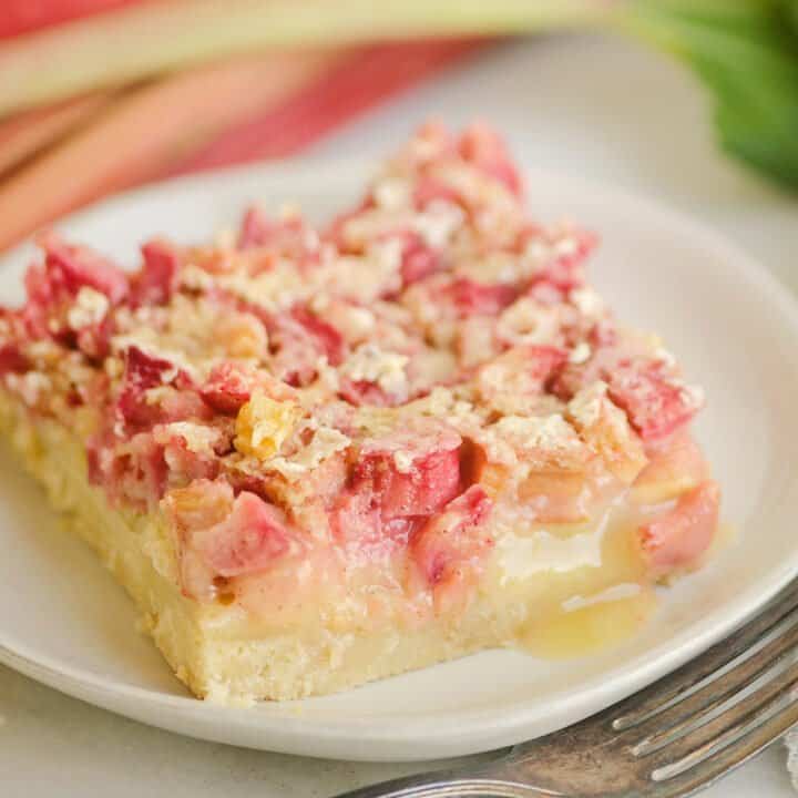 rhubarb dream bar on white plate with fork