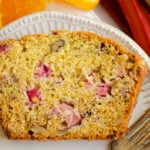 slice of rhubarb walnut orange bread with fork on plate