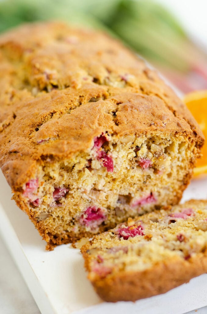 sliced rhubarb walnut orange bread on serving board