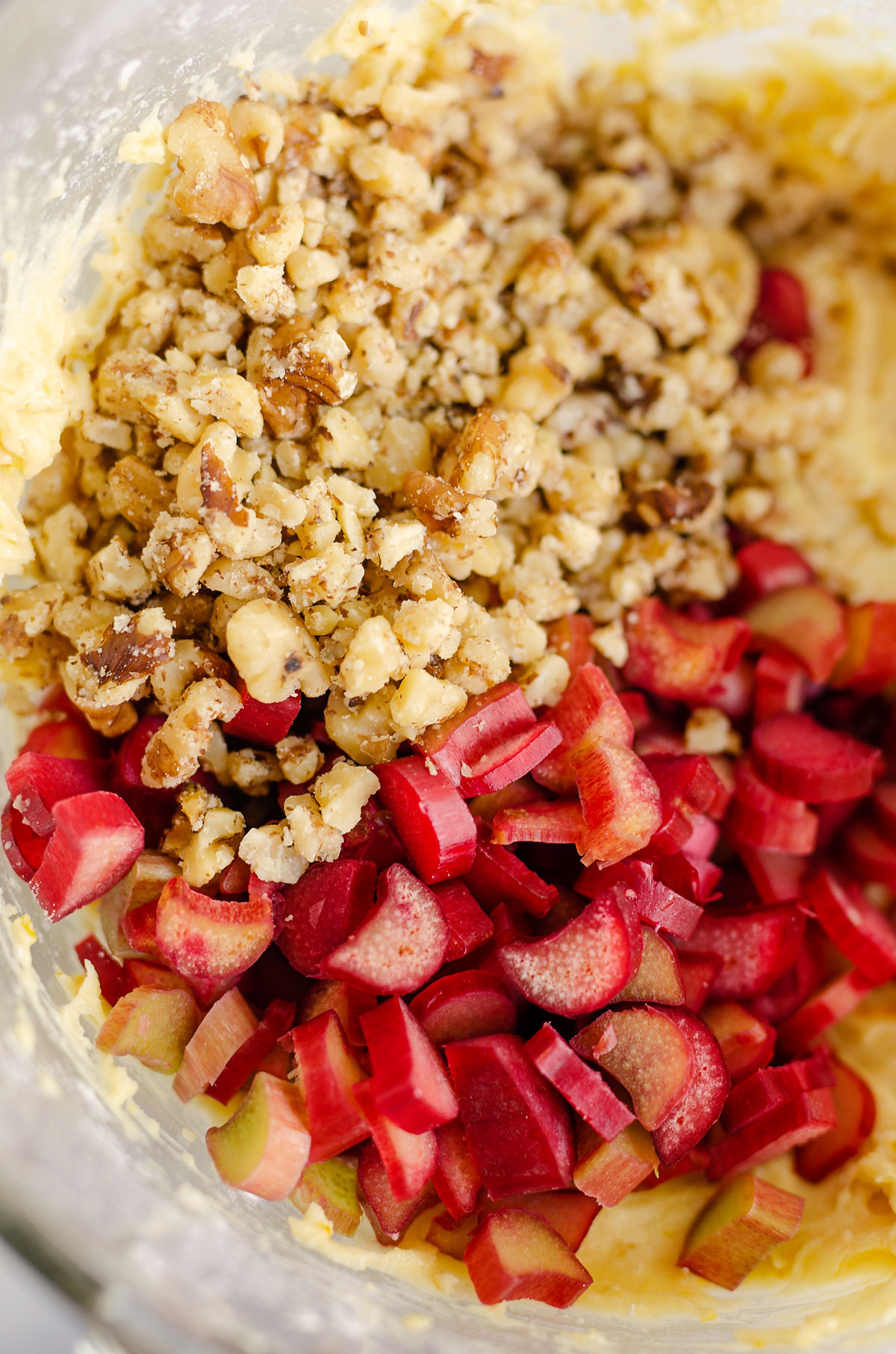 chopped rhubarb and walnuts in mixing bowl