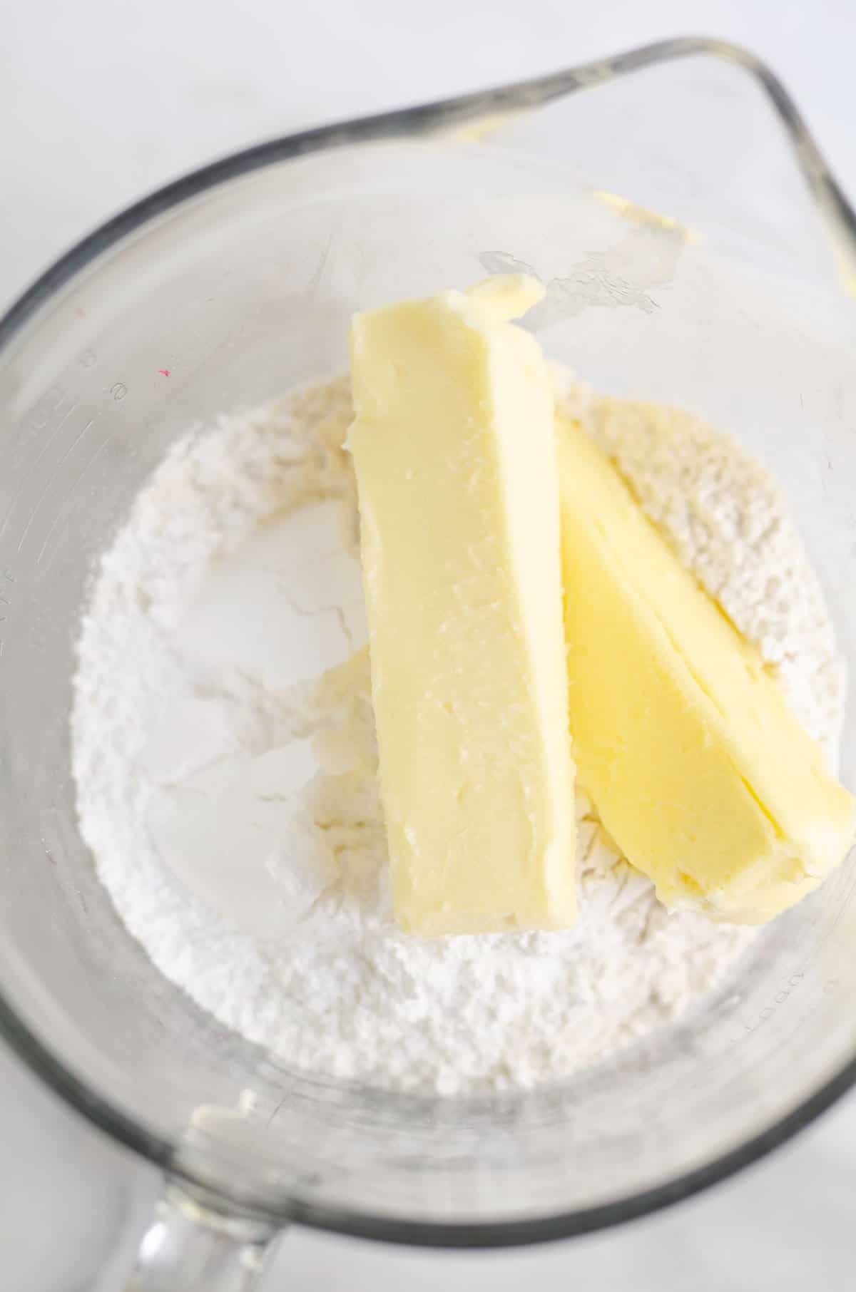 butter flour and powdered sugar in bowl