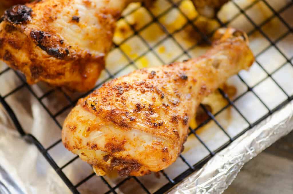 baked chicken leg on cooling rack