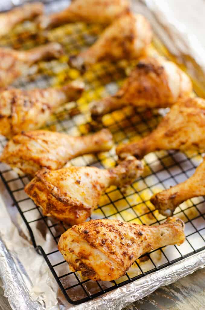 crispy baked chicken drumsticks on cooling rack