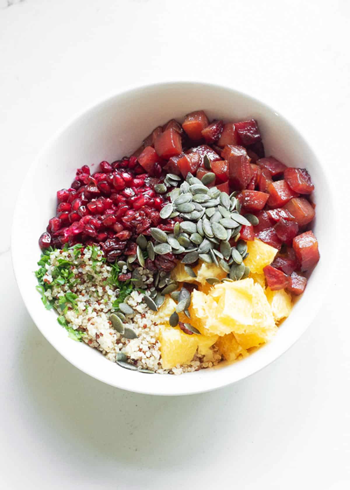 ingredients for Beet & Orange Quinoa Salad in bowl not mixed