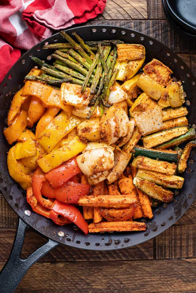 smoked peppers, zucchini and onions in grill basket