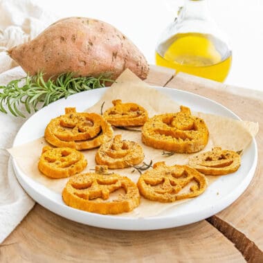 jack o lantern roasted sweet potatoes served on white plate