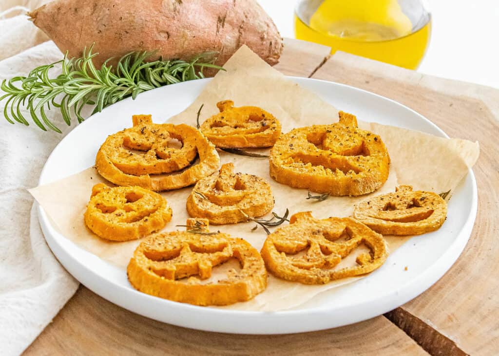 jack o lantern roasted sweet potatoes served on white plate