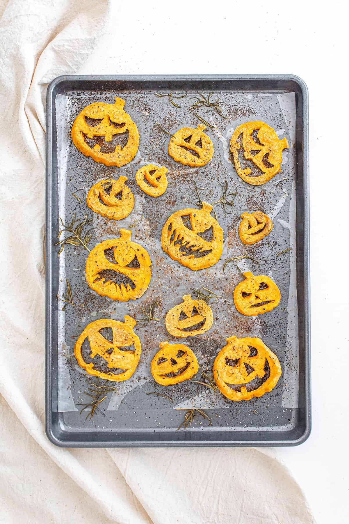 jack o lantern sweet potatoes roasted on baking sheet