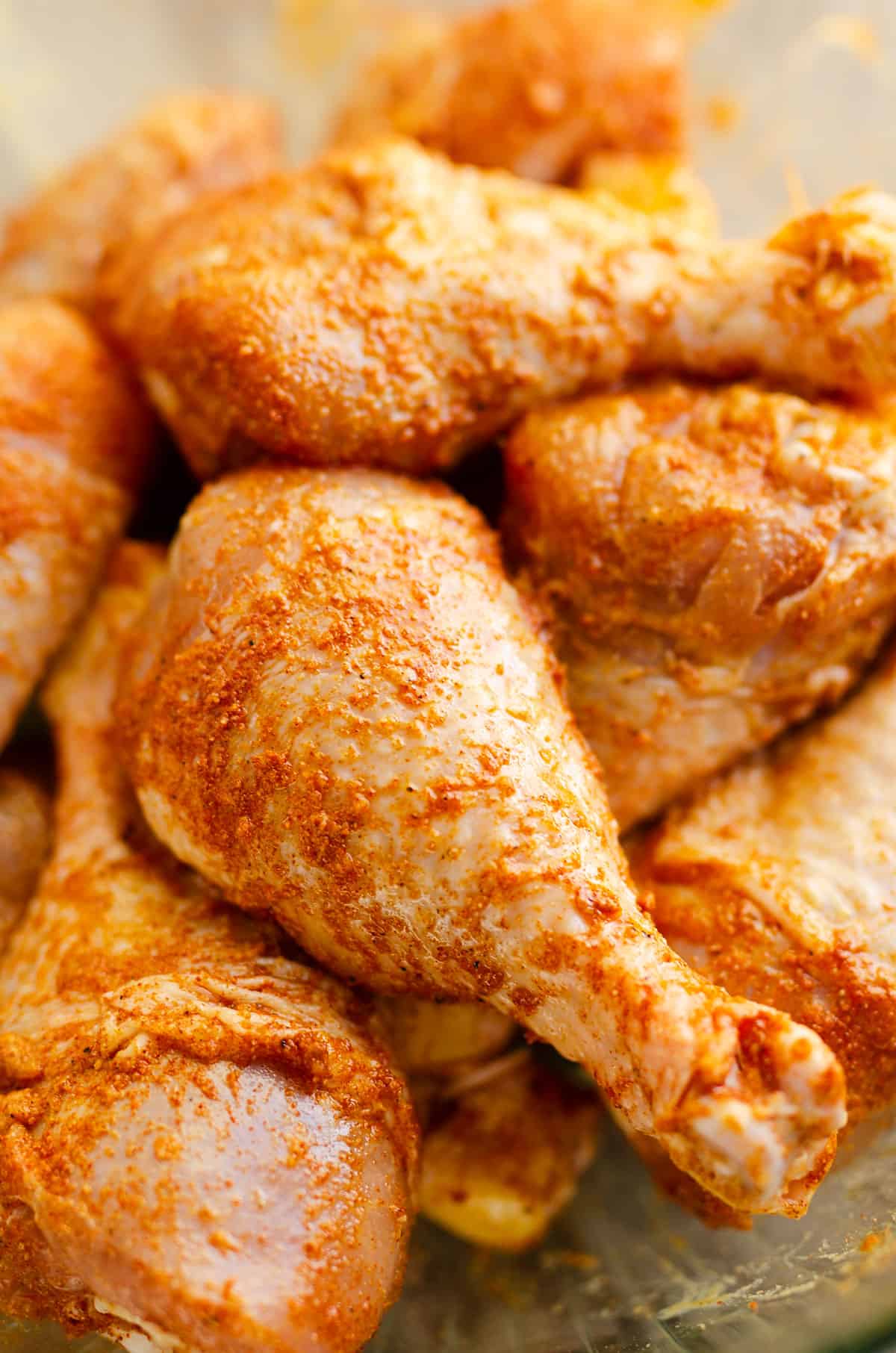 chicken drumsticks seasoned in bowl