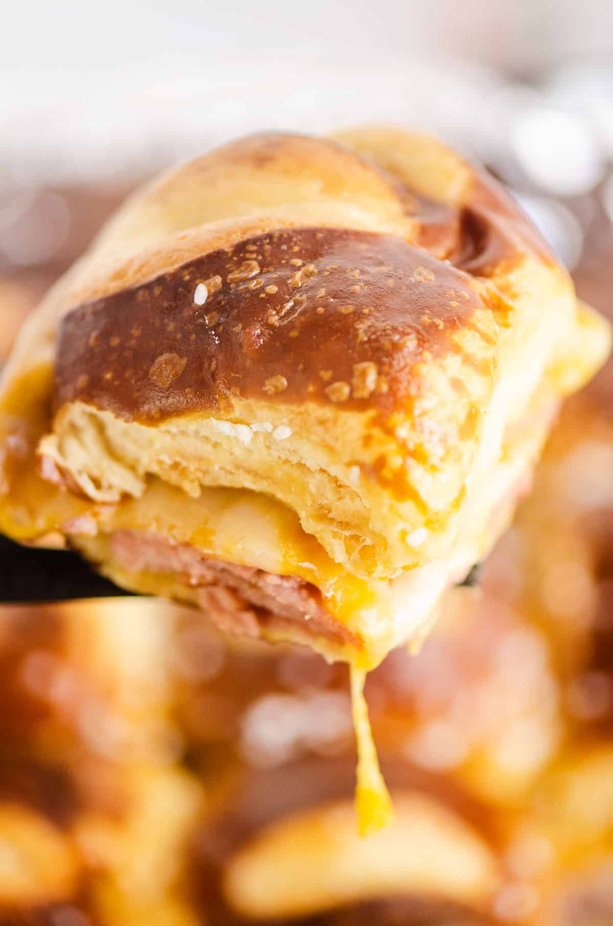 cheese pull from pretzel slider