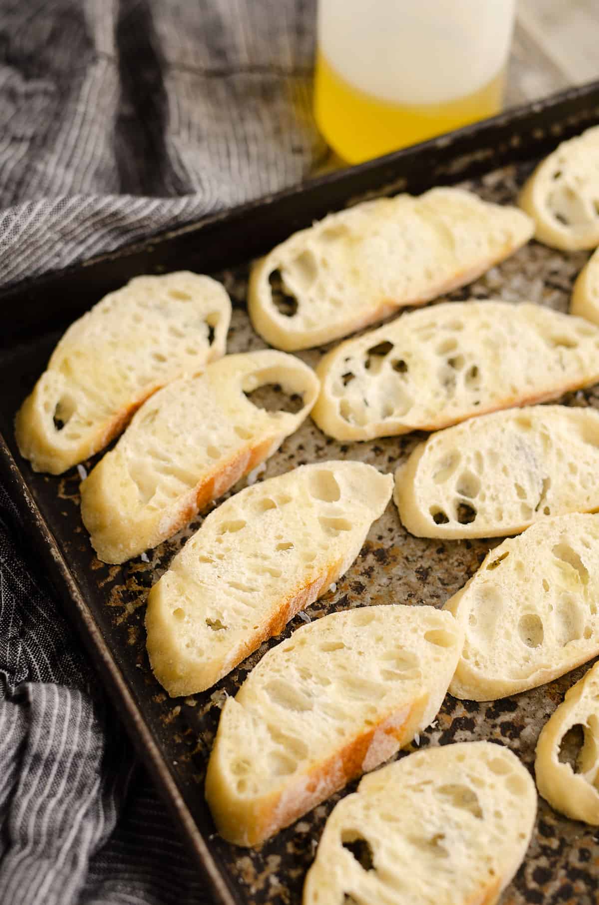 sliced baguette on sheet pan