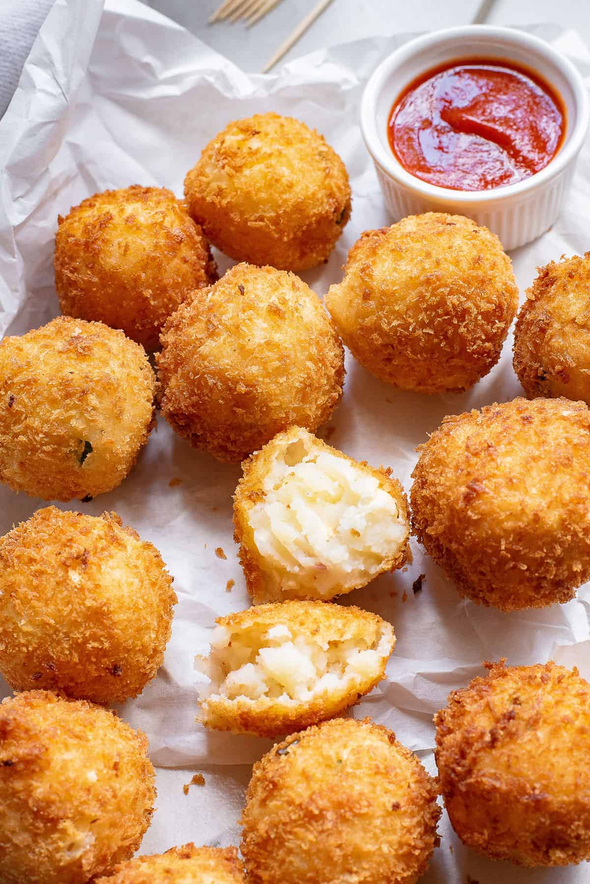 mashed potato balls on parchment paper