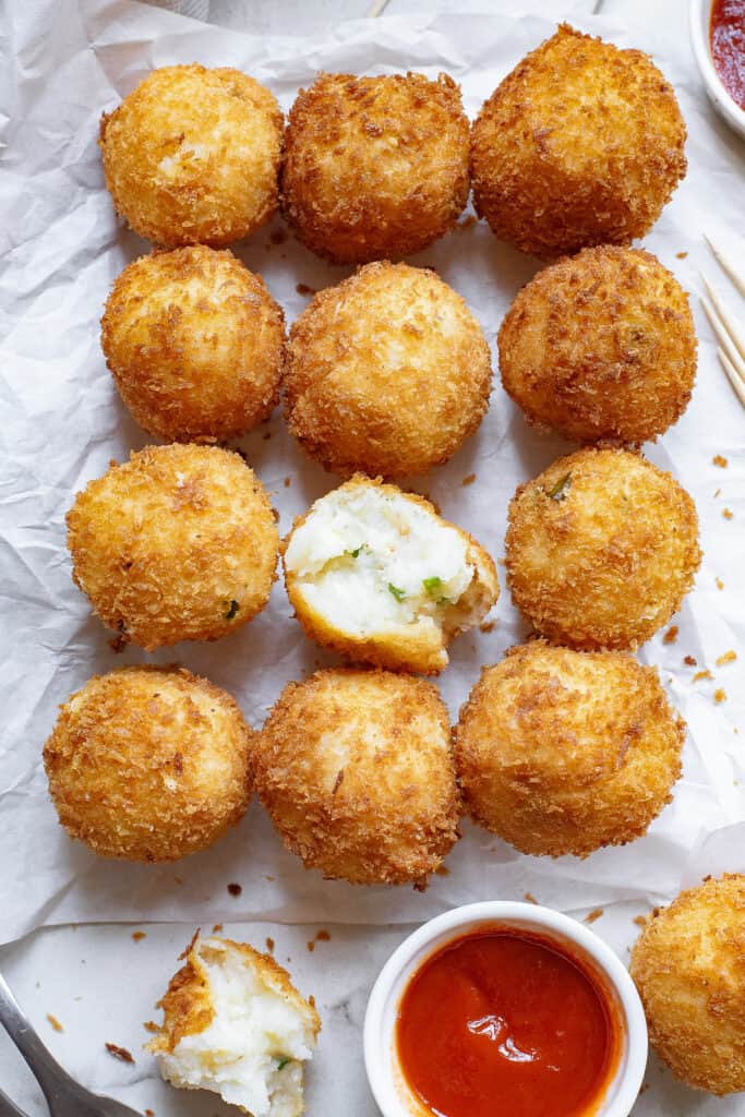 fried mashed potato balls on platter