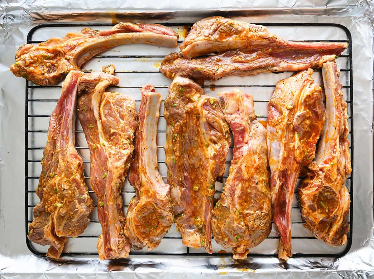 marinated lamb chops on baking sheet