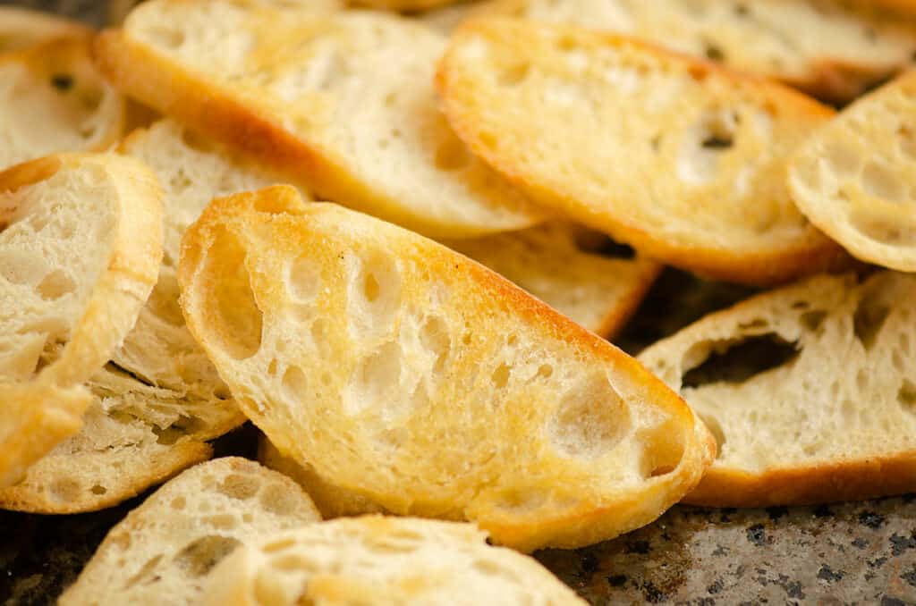 crostini piled on pan