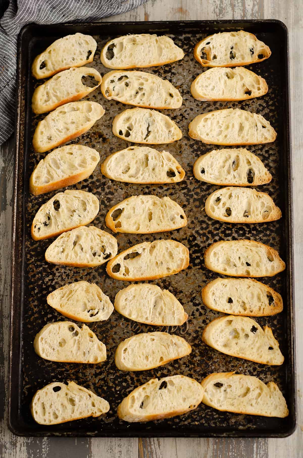 crostini lined on baking sheet