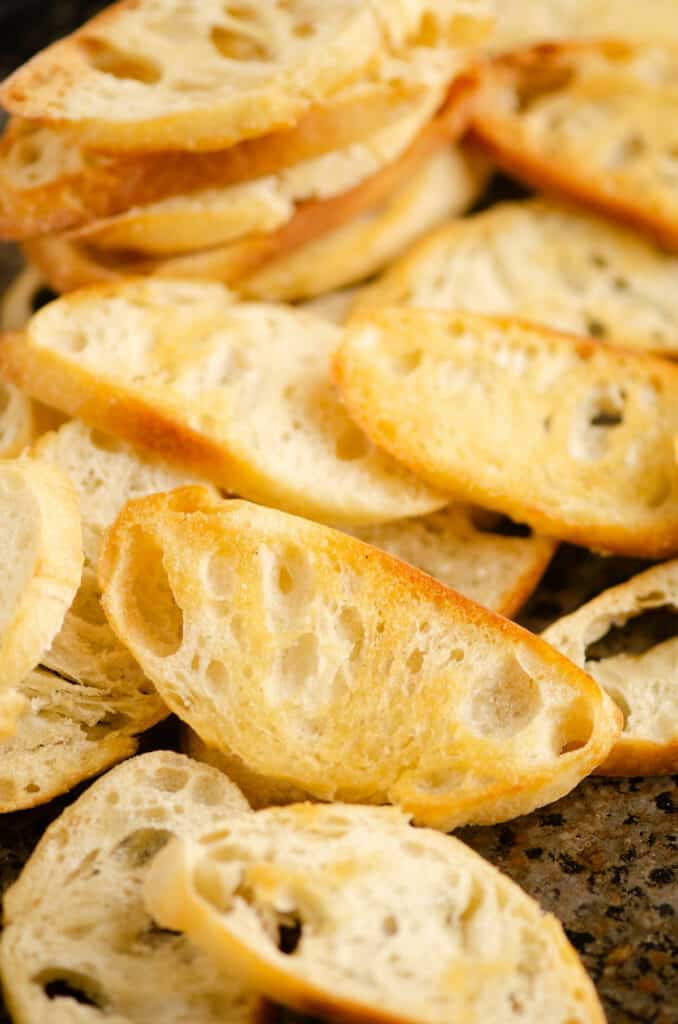 toasted crostini on baking sheet