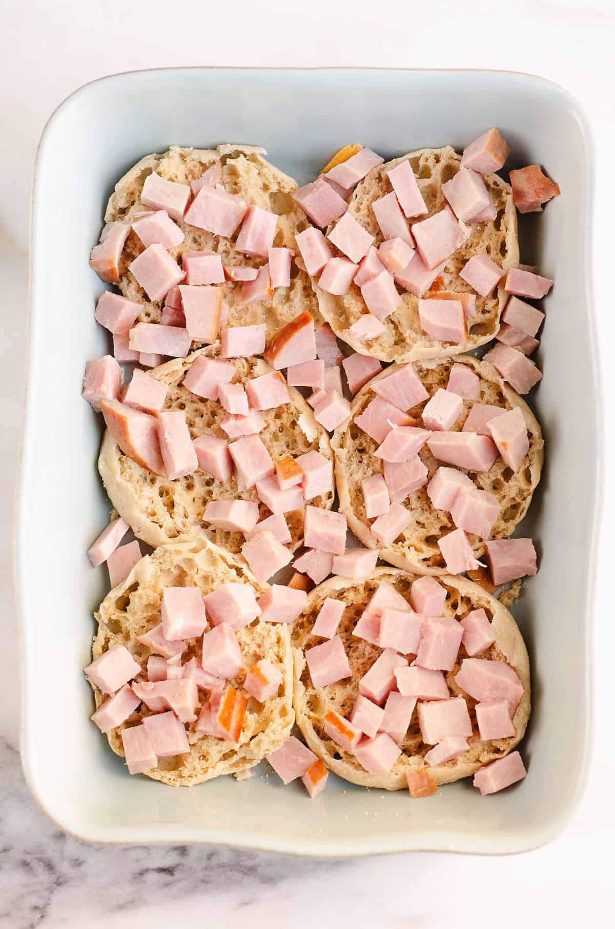 ham topped english muffins in pan